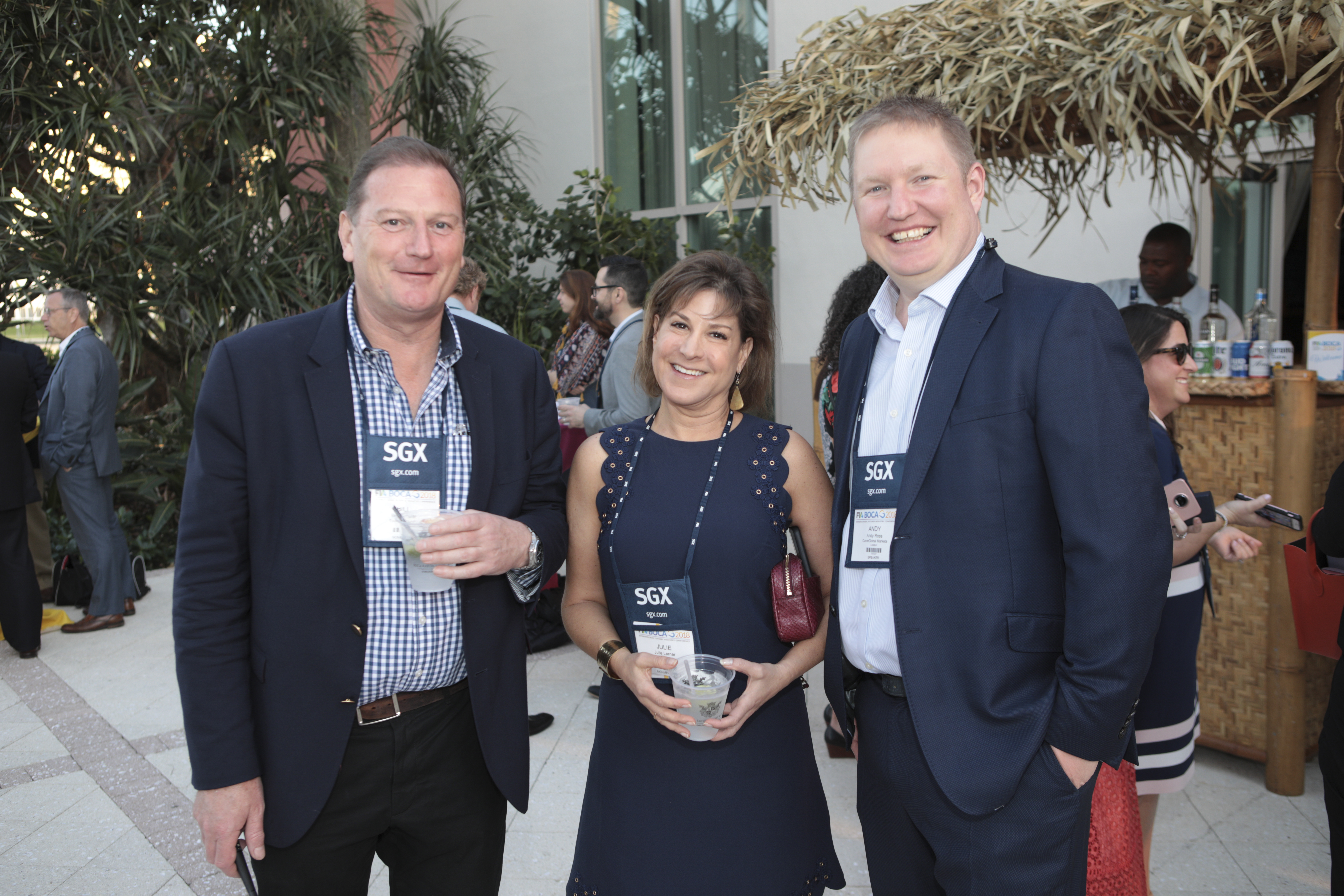 Bill Templer of Seismic Foundry, Julie Lerner of PanXchange and Andy Ross of Curve Global catch up during one of the receptions. 