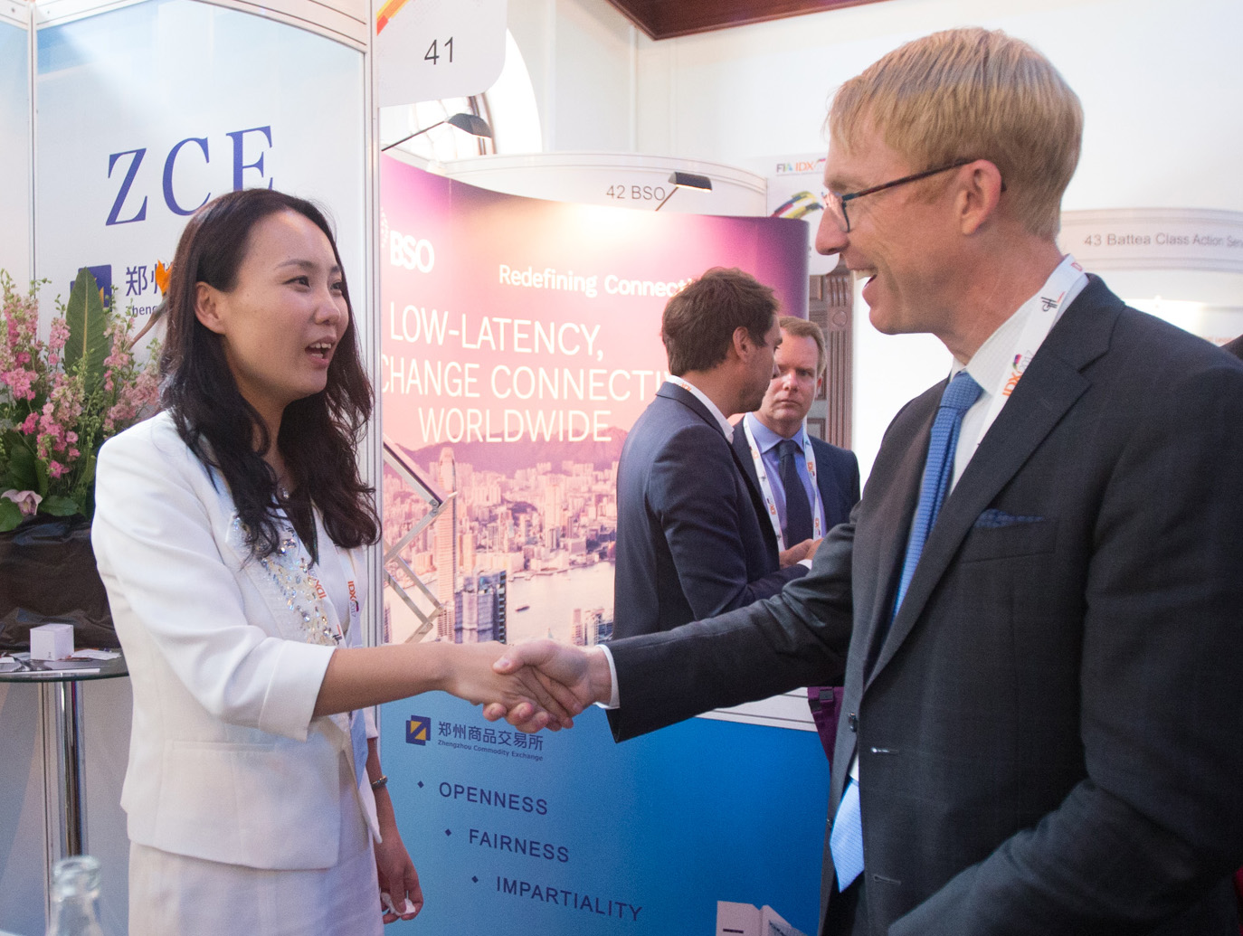 Walt Lukken greets IDX exhibitors