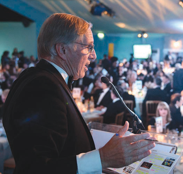 The auctioneer getting the best from the audience – including a mighty amount for the traditional giant Toblerone