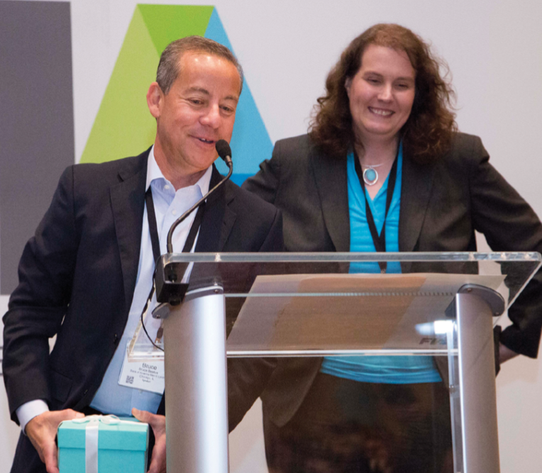 Kimberly Johns of Goldman Sachs and president of Law and Compliance recognizes Bruce Beatus of Bank of America Merrill Lynch for serving as co-president of the division.