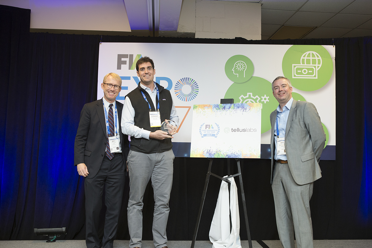 Walt Lukken (L) and Matt Haraburda (R) present the FIA Innovator of the Year award to Fernando Rodriguez-Villa of TellusLabs. Photo Credit: FIA