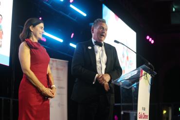 David Martin and Julie Winkler accept the sporran after being named the 2027 Kilt Challenge participants at the IDX Gala